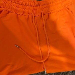 Orange joggers size Medium